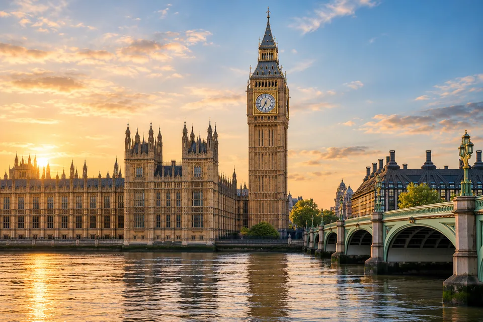 Elizabeth Tower and Westminster Bridge beside the Thames in warm light
